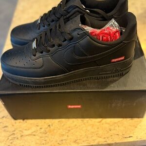 Supreme Black Nike Airforce 1 Sneakers with Red Details